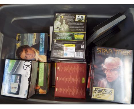 A box containing a quantity of CD's and DVD's, a Garmin Sat Nav in box and a boxed Kodak Easy Share SV 710 digital picture fr