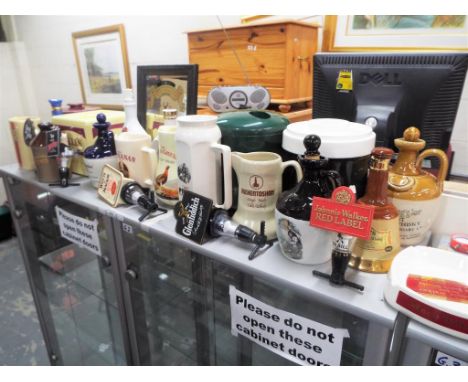 Breweriana - a large quantity Whisky related collectables to include ice buckets, water jugs, empty Whisky jugs, optics, adve