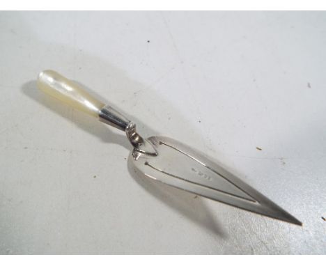 A hallmarked silver miniature trowel. Est £20 - £30