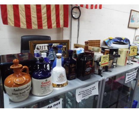 Breweriana - a large quantity Whisky related collectables to include advertising mirror, water jugs, empty Whisky jugs, ice b