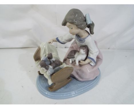 Lladro - A Lladro figurine # 5784, A Cradle of Kittens, stamped and impressed marks to the base, approximately 15.5 cm (h). E