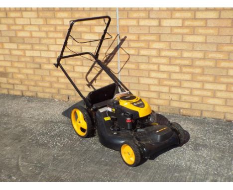 A petrol driven Lawn Mower by McCulloch, model M53-625CMDW with operating manual