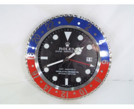 An advertising wall clock. Estimate £90 - £120