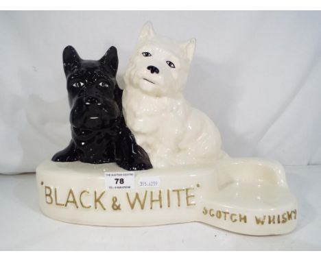 A Black and White Scotch Whisky ceramic advertising display by Crown Devon, approx 25.5cm (h) to the tip of the West Highland