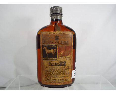 White Horse Cellar - a half bottle of The Old Blend Scotch Whisky of The White Horse Cellar aged in wood bottled 1939, bottle