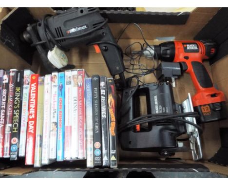 A quantity of DVDs and Black and Decker power tools