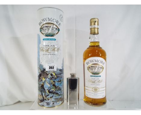 Bowmore Legend Islay single malt Scotch whisky, issued in a limited edition in pictorial metal tube with white metal hip flas