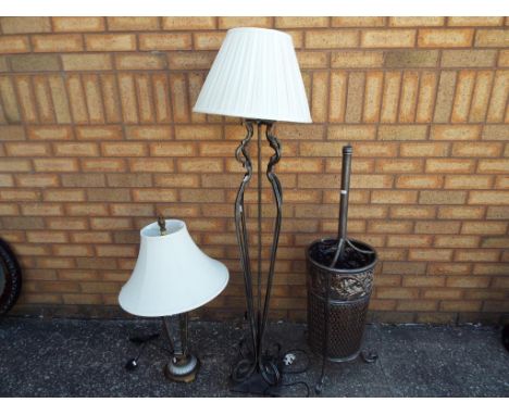 A good lot to include a metal umbrella stand approx 102cm (h), a floor lamp and shade approx 140cm (h) and a table lamp with 