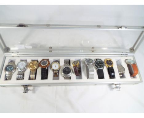 A display case containing twelve watches to include Rotary, Timex, Sekonda, Rojas and similar - This lot MUST be paid for and