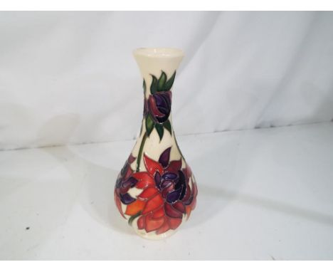 Moorcroft - a Moorcroft vase decorated in the Red Ruby pattern, approximate height 17 cm. Estimate £80 - £100