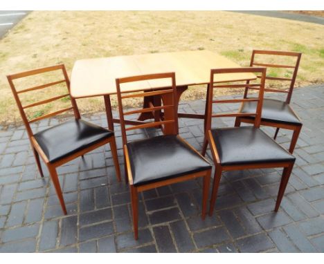 G Plan furniture - a teak drop-leaf dining table and four McIntosh ladder-back dining chairs with faux leather black seats  (