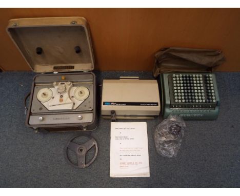 Lot to include a Sumlock adding machine, a cased Prinz Mirage dual 8 projector and a cased Philips reel to reel player. (2)