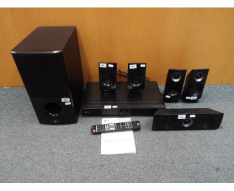 An LG 5.1 channel surround sound system with manual (8)