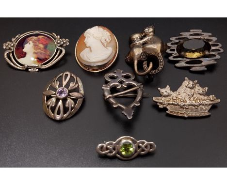 GOOD SELECTION OF EIGHT SILVER BROOCHESof various designs including a cameo brooch in silver mount marked 800; one in the for