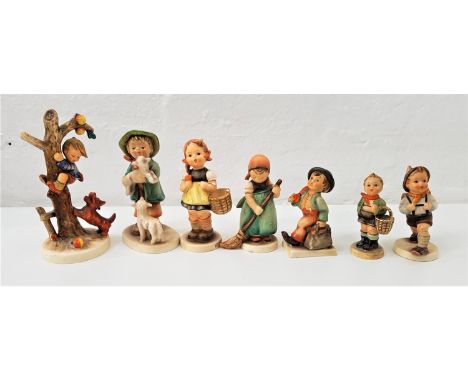 SEVEN GOEBEL HUMMEL FIGURESincluding a boy climbing an apple tree with dog at base, a girl sweeping, a boy with lambs, and a 