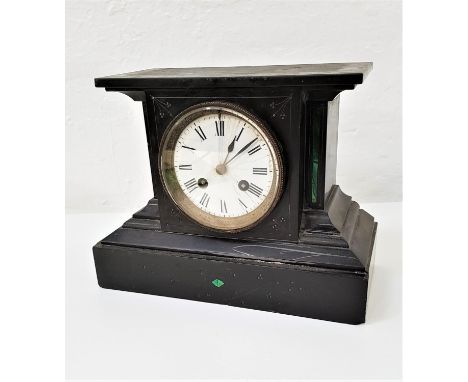 VICTORIAN BLACK SLATE MANTLE CLOCKin a shaped case with a circular white enamel dial with an eight day movement, 20cm high 