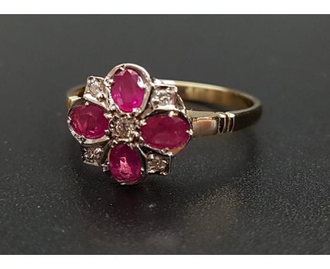 RUBY AND DIAMOND CLUSTER RINGthe four oval cut rubies separated by small diamonds and with a further diamond to the centre, o