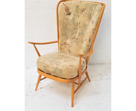 ERCOL BEECH ARMCHAIRwith a shaped stick back with a loose button back cushion above a padded seat, standing on turned support