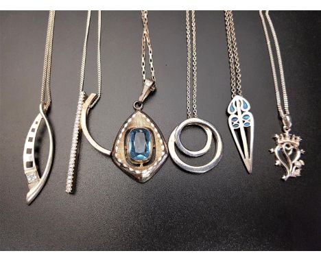 SIX SILVER PENDANTS ON CHAINScomprising a pierced enamel decorated example, another with central faceted blue glass, CZ set e