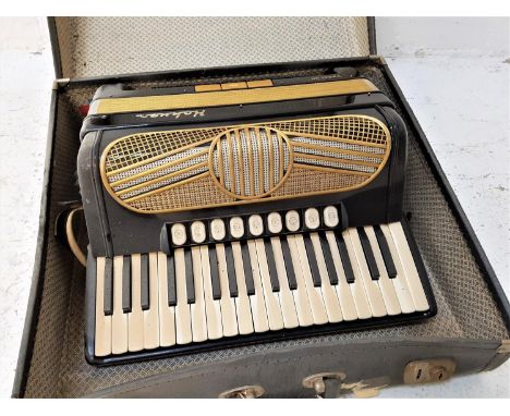 HOHNER VERDI IIN ACCORDION with a black gloss with gilt highlights to the body, with shoulder strap, cased 