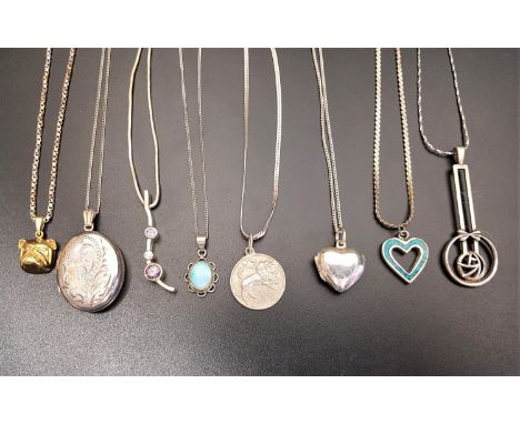 EIGHT SILVER PENDANTS ON CHAINSincluding a cabochon opal pendant, a scroll engraved oval locket, a silver gilt bulldog pendan