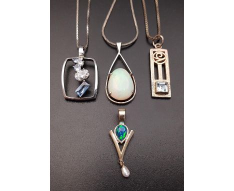 FOUR SILVER PENDANTScomprising a an opal mosaic and seep pearl pendant; another with simulated opal; a blue topaz set Charles