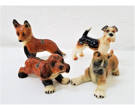 FOUR GERMAN DOG FIGURINESmakes include Goebel and Cortendorf, the largest 11.3cm high (4) 