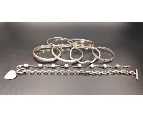 EIGHT VARIOUS SILVER BANGLES AND BRACELETSincluding a Mackintosh style bangle, two hinged bangles with engraved decoration, t