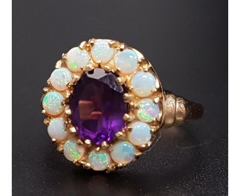 AMETHYST AND OPAL CLUSTER RINGthe central oval cut amethyst approximately 1.1cts in 12 opal surround, on nine carat gold shan