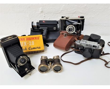 SELECTION OF CAMERA AND OPTICAL EQUIPMENTcomprising Zorki-4k camera in case, Kodak junior II folding camera with case, Browni
