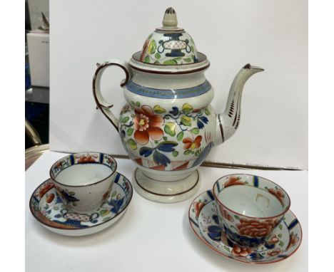 A Gaudy Dutch coffee pot together with two bowls and saucers