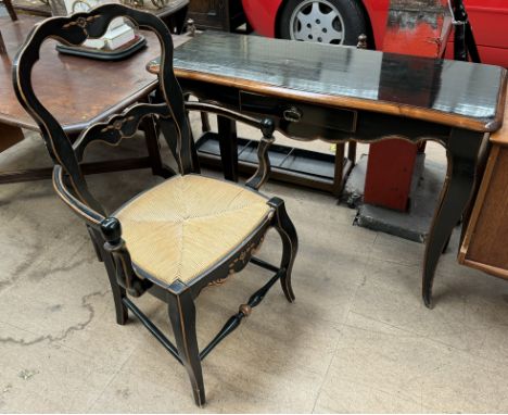 An ebonised console table with a single drawer on square tapering legs together with a matching elbow chair 