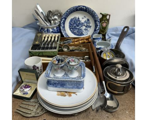 Assorted electroplated and stainless steel cutlery together with an AA badge, blue and white pottery, plates etc