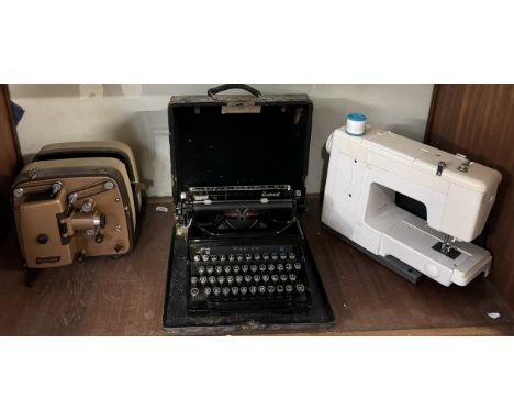 A Specto Royal projector together with an Everest typewriter and a sewing machine 