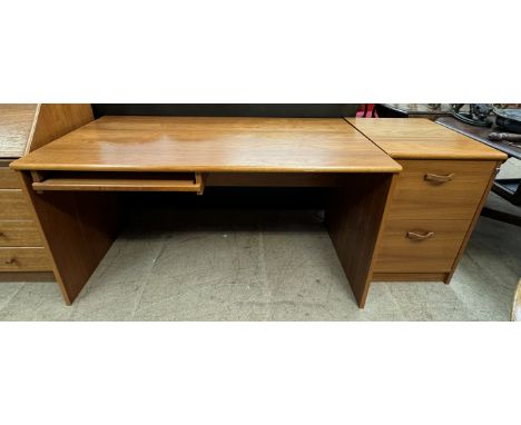 A Danish teak desk together with a teak filing cabinet 