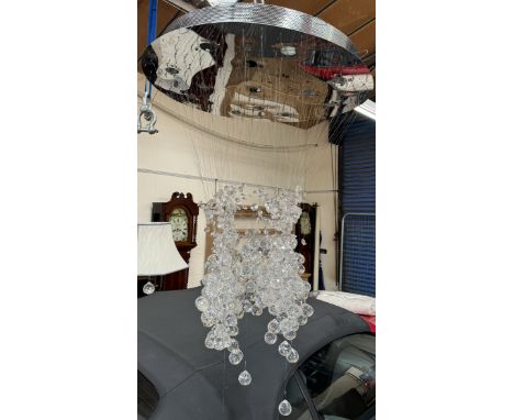 A chrome roof light / chandelier with a circular chrome roof panel with crystal ball drops on wires 