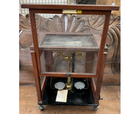An Oertling chemical balance scales in a mahogany case 