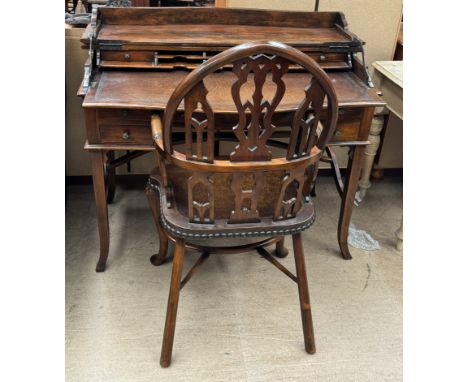 A reproduction mahogany lady's writing desk with a hinged top enclosing pigeon holes drawers and a leather top above drawers 