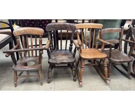 Two 19th century children's stick back rocking chairs together with a child's stick back elbow chair and a child's chair with