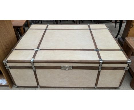 A coffee table in the form of a banded trunk with a drawer, 132cm wide x 97cm deep x 46cm high 
