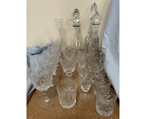 A set of five crystal wine glasses together with assorted glass decanters and other glasses