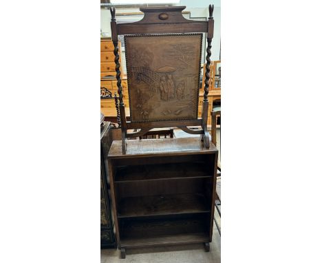 An oak bookcase together with an oak firescreen with a leather decorated panel decorated with an Oriental scene 