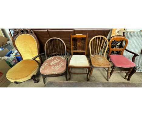 A Victorian rosewood nursing chair with a carved and pierced upholstered back and seat on scrolling legs together with a mid 