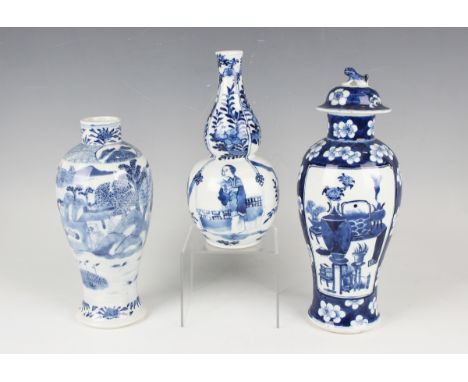 A Chinese blue and white porcelain double gourd shaped vase, mark of Kangxi but late 19th century, the lower bulb painted wit