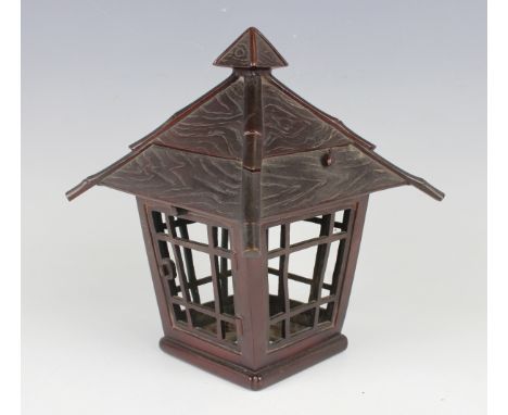 A Japanese brown patinated bronze lantern, Meiji/Taisho period, with tile effect cover and pierced tapering sides, height 21.
