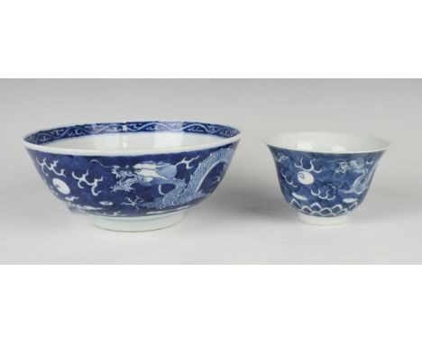 A Chinese blue and white porcelain bowl, late 19th century, of steep-sided circular form, the exterior painted with a pair of