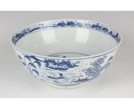 A Chinese blue and white porcelain bowl, mark of Kangxi but late 19th century, painted inside and out with figures and pavili