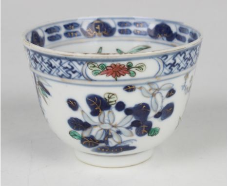 A Chinese underglaze blue and famille rose enamelled porcelain teabowl, mark of Kangxi but late 19th century, decorated with 