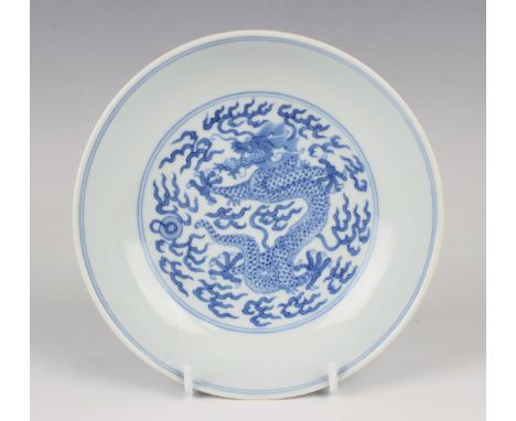 A Chinese blue and white porcelain saucer dish, mark and period of Daoguang, the centre painted with a five-clawed dragon, fl