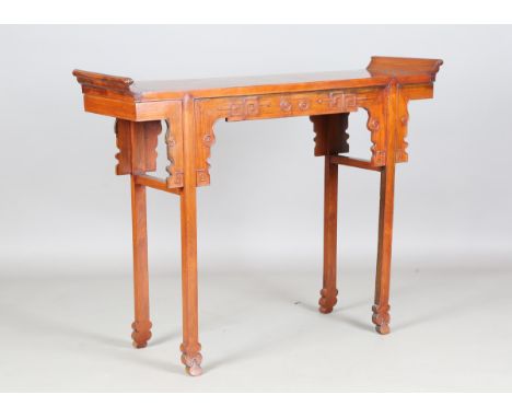 A Chinese hardwood altar table, 20th century, the rectangular top inset with two burr panels and flanked with scroll ends, th